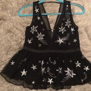 Black and silver star peplum top